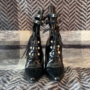 Black leather Ellie lace up and strap hills. Size 7 womens lightly worn